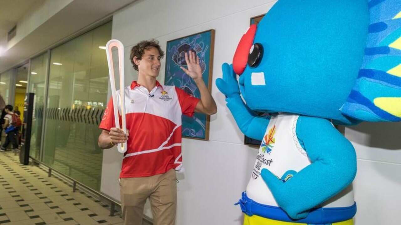 Swimmer Cameron McKay with the Commonwealth Games mascot
