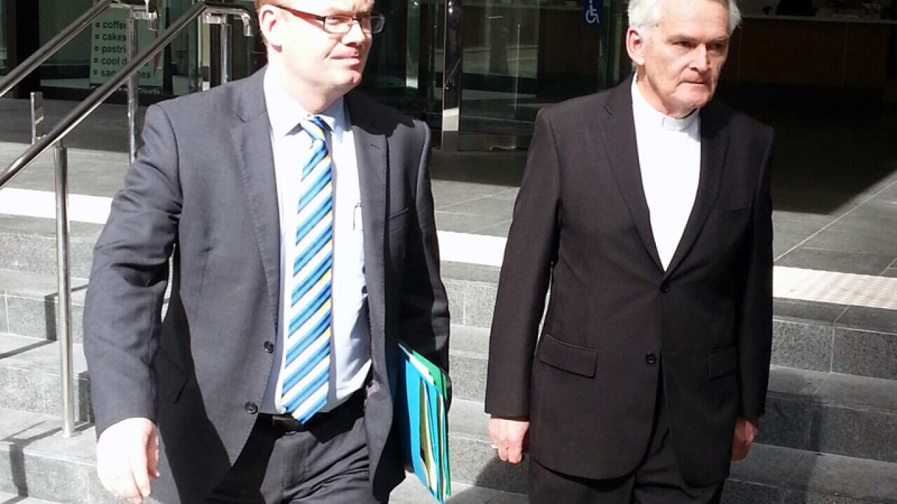 Bishop Max Davis (right)