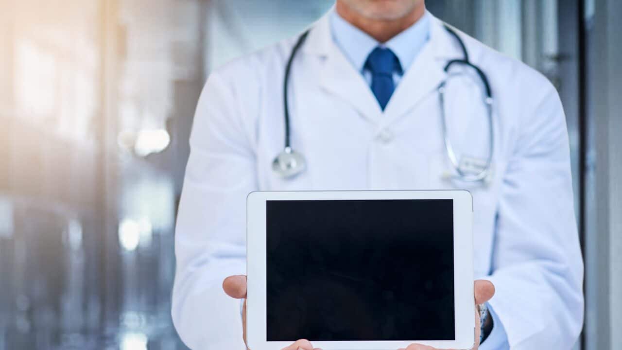 Doctor with screen