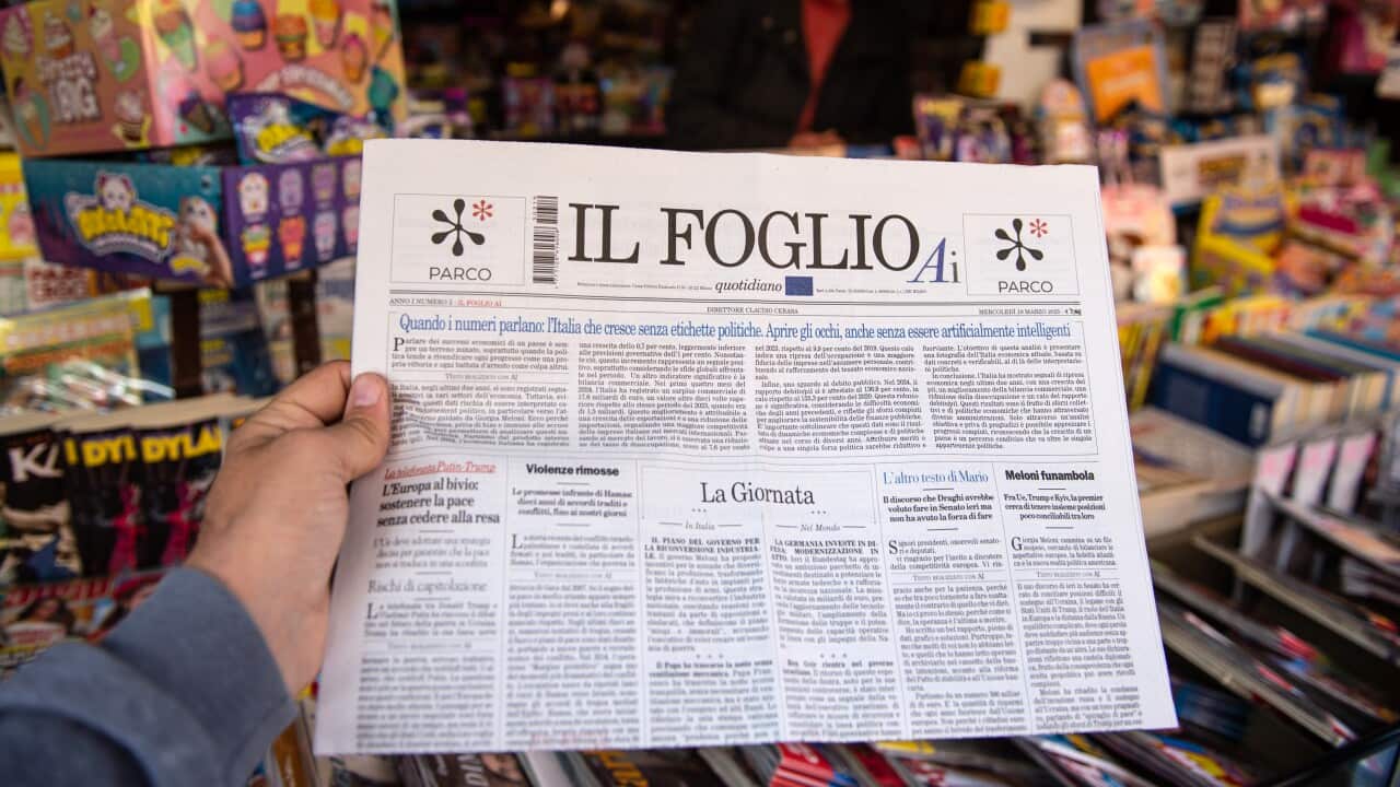 A person holds a copy of the Italian daily newspaper "Il Foglio AI" made with artificial intelligence on newsstands at on March 19, 2025 in Salerno, Italy.