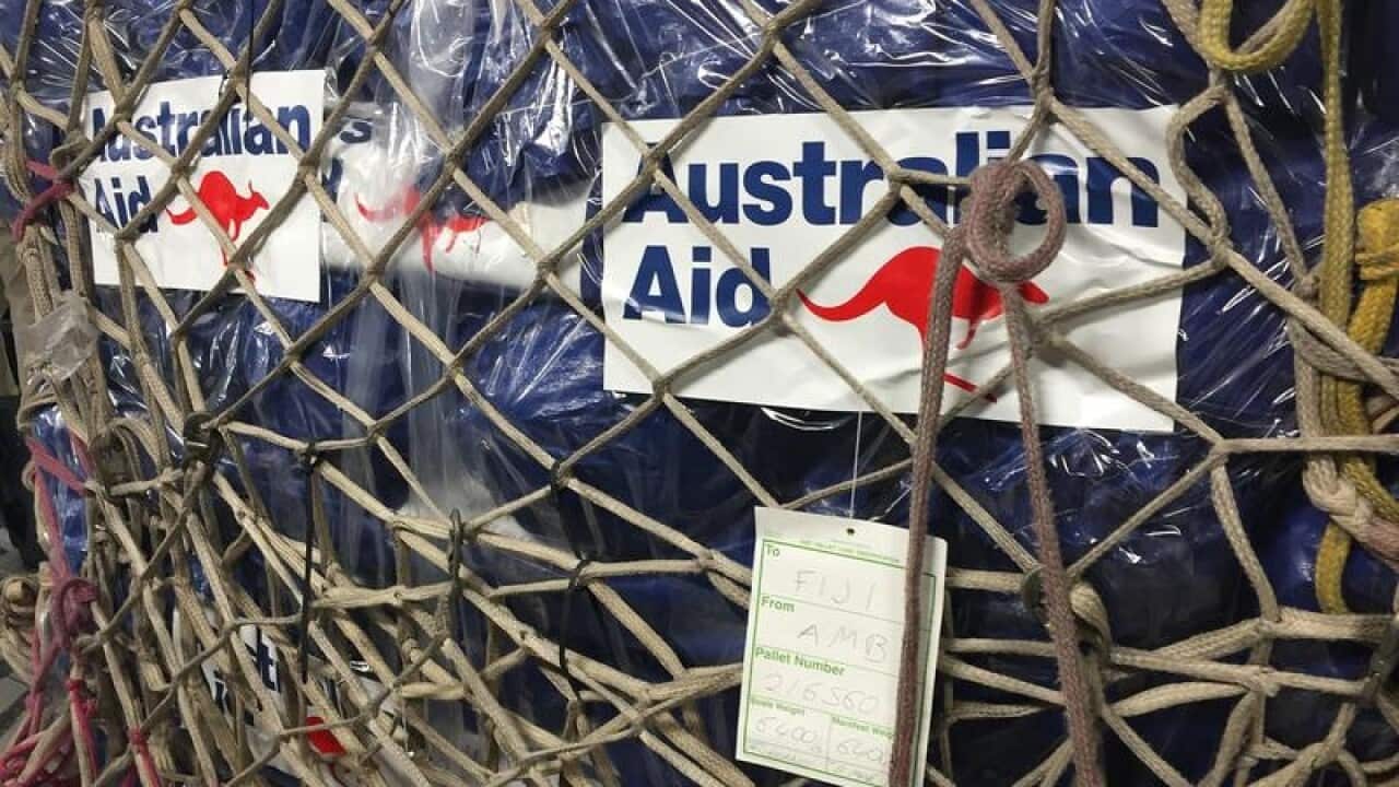 Pallets and packages of Australian aid bound for Fiji.