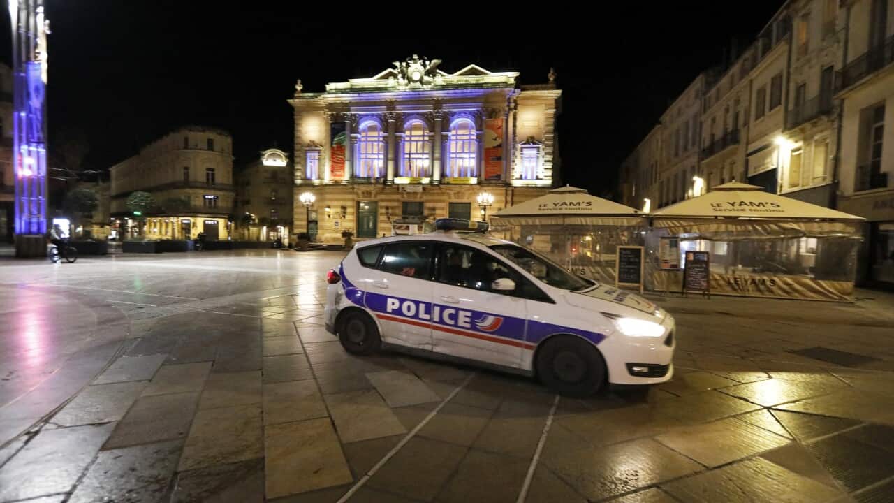 French Police patrol past closed restaurants terraces in Montpellier