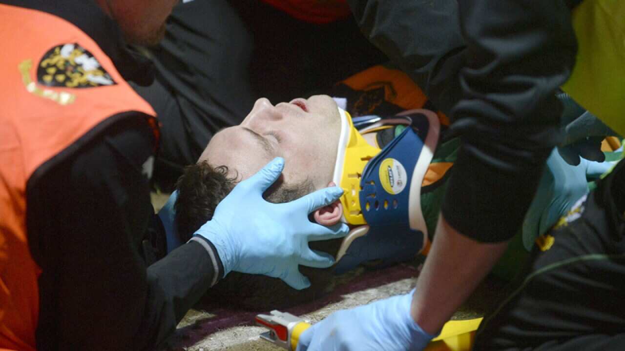 Wales rugby winger George North is treated for a head injury