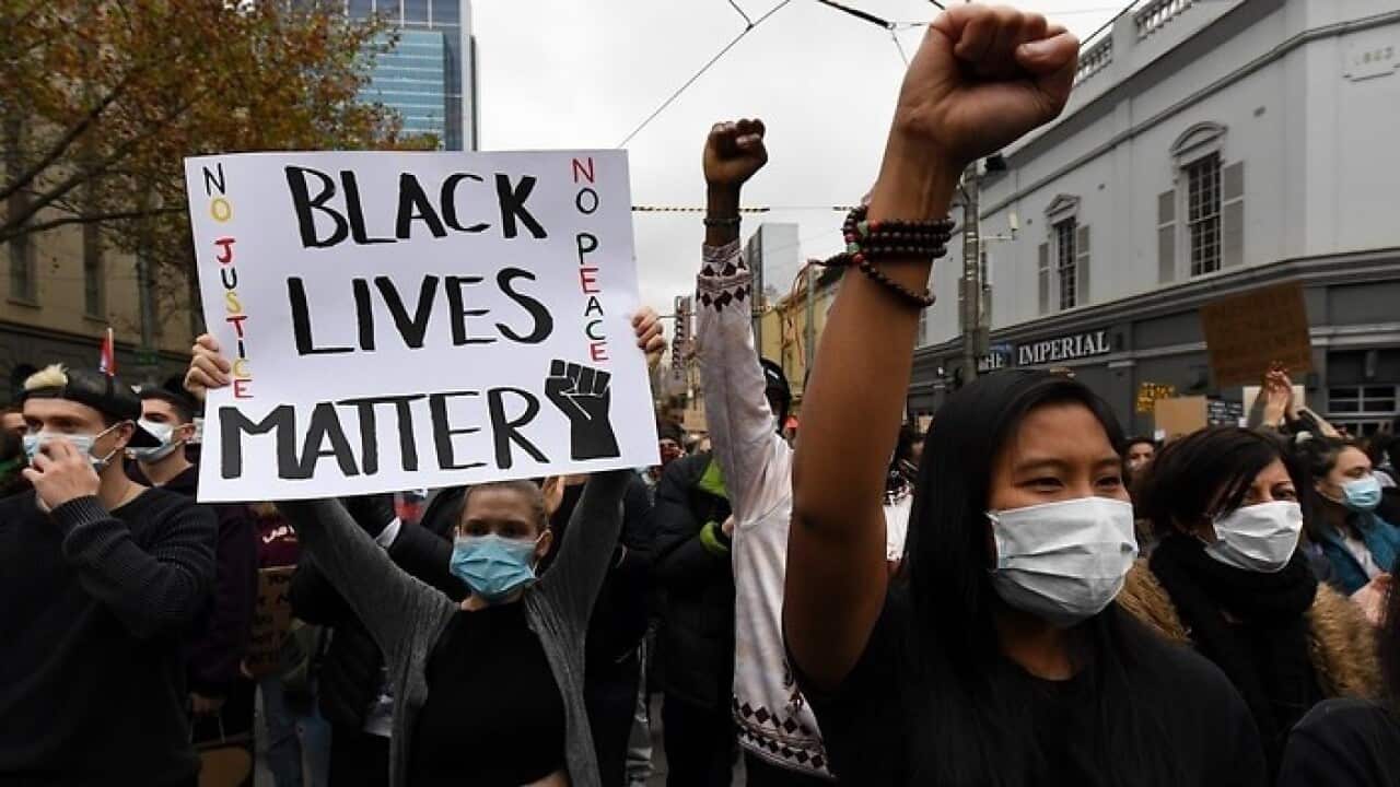 Protesters are seen during a Black Lives Matter rally in Melbourne, Saturday, June 6, 2020.