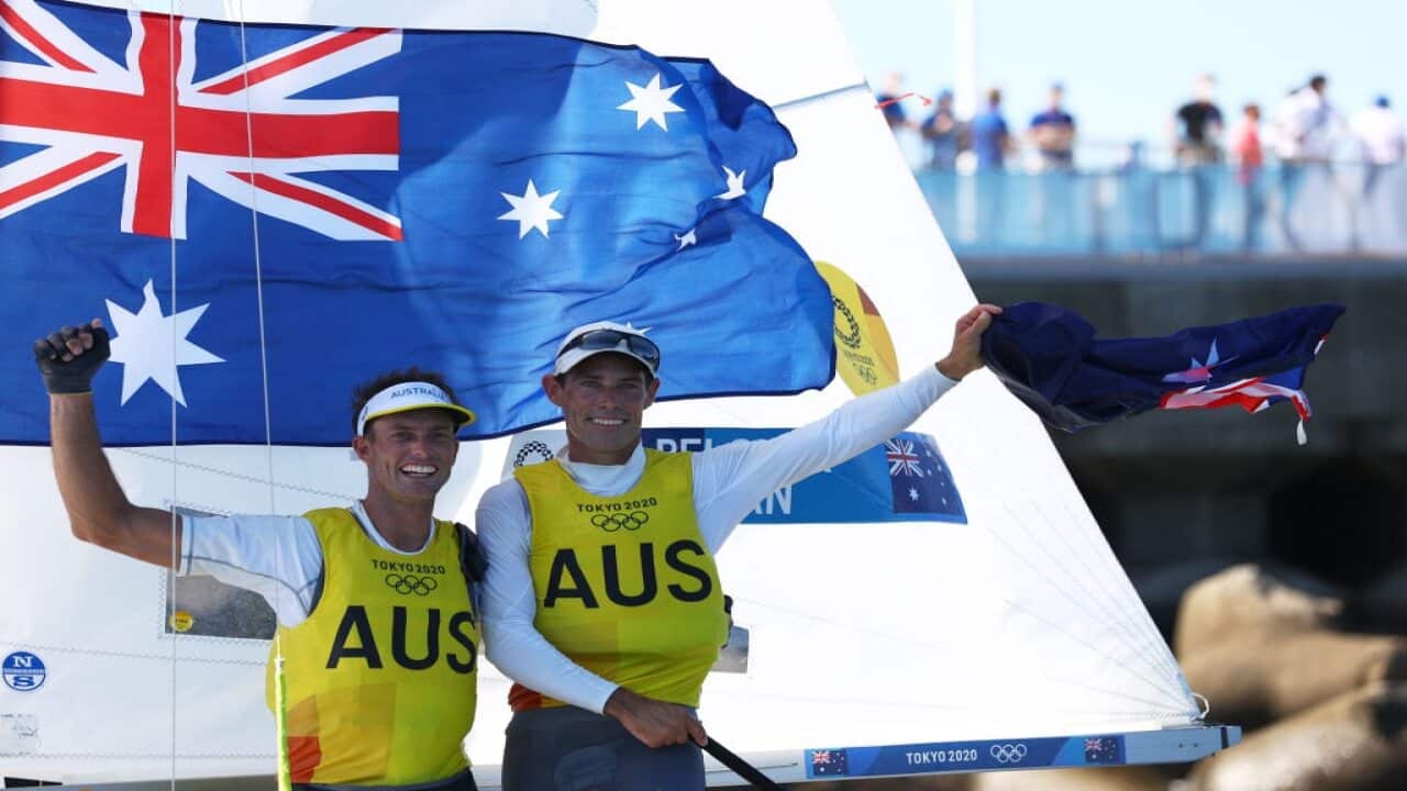 Mathew Belcher and Will Ryan of Team Australia celebrate winning gold in the Men's 470 class on 4 August, 2021.