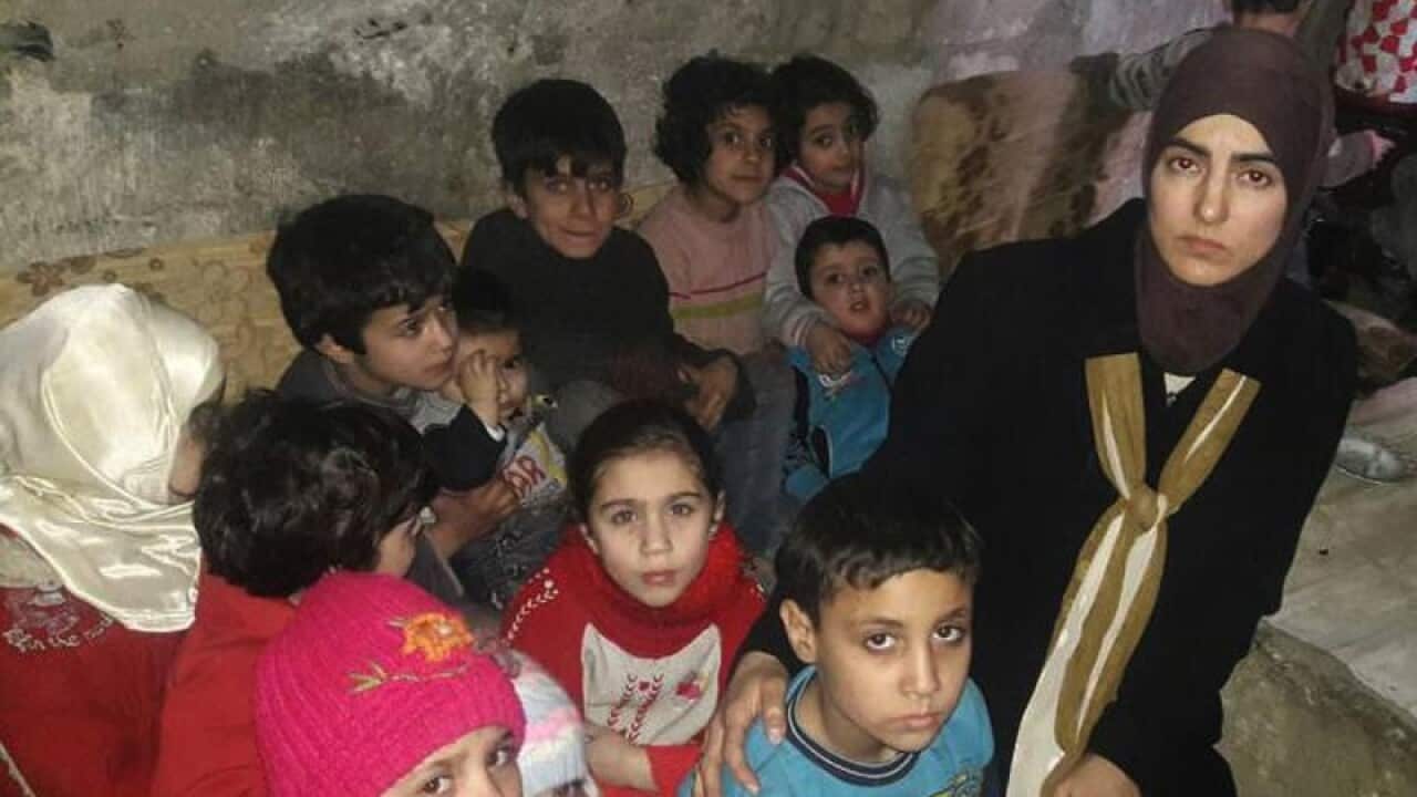Women and children take shelter in Ghouta, Syria