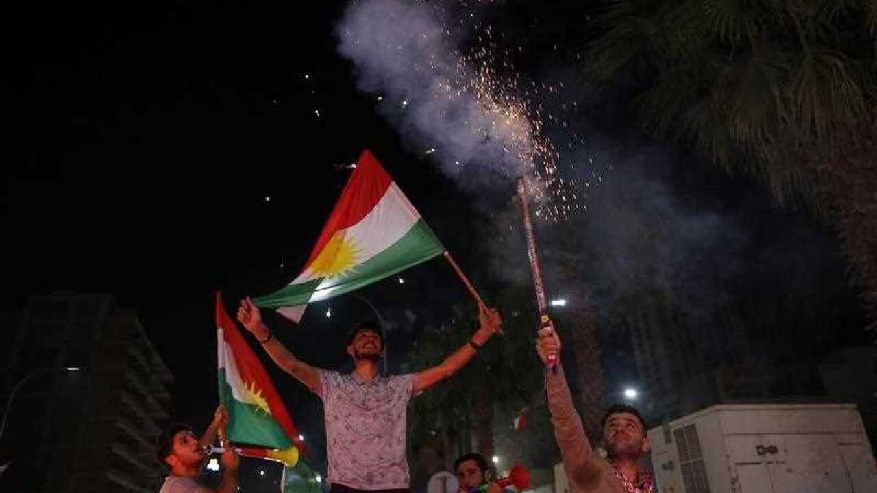 Kurds celebrate after the announcement of the results of the independence referendum in Erbil, Kurdistan region in northern Iraq, 26 September 2017.