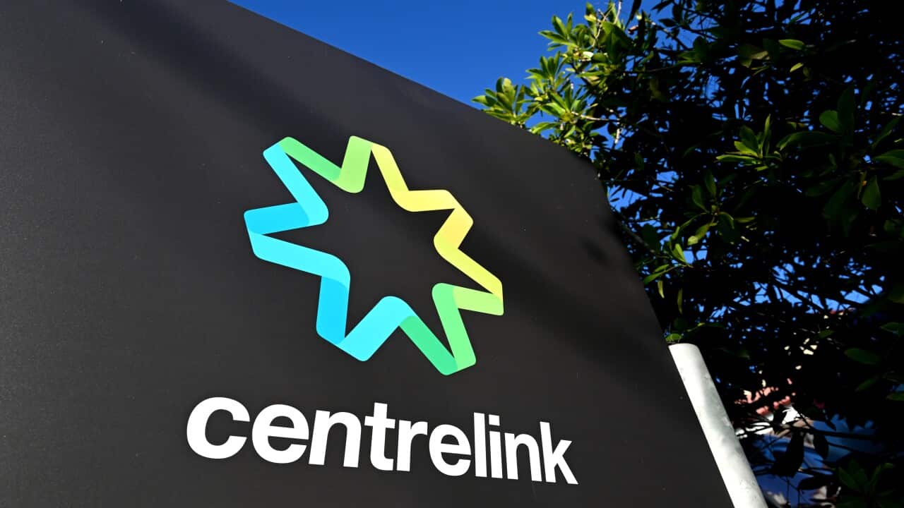 A sign for Centrelink in a bush