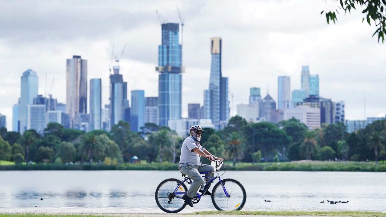 People exercise at Albert Park Lake in Melbourne