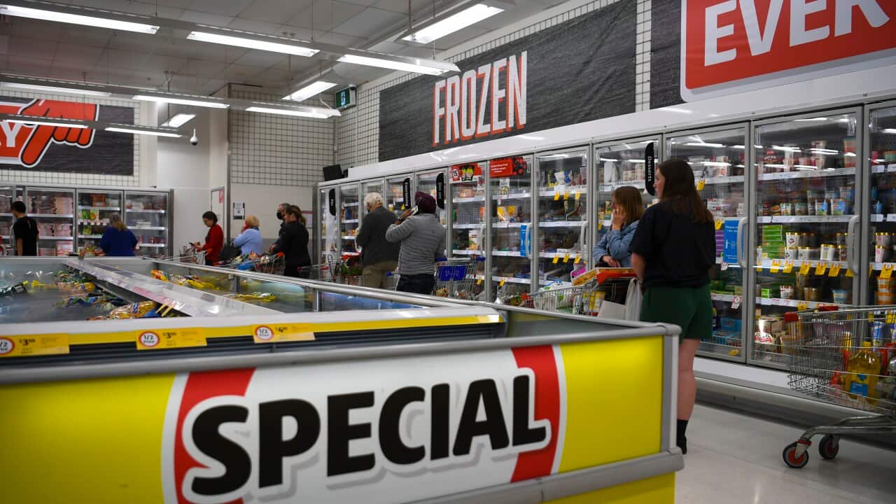 A supermarket interior advertising specials