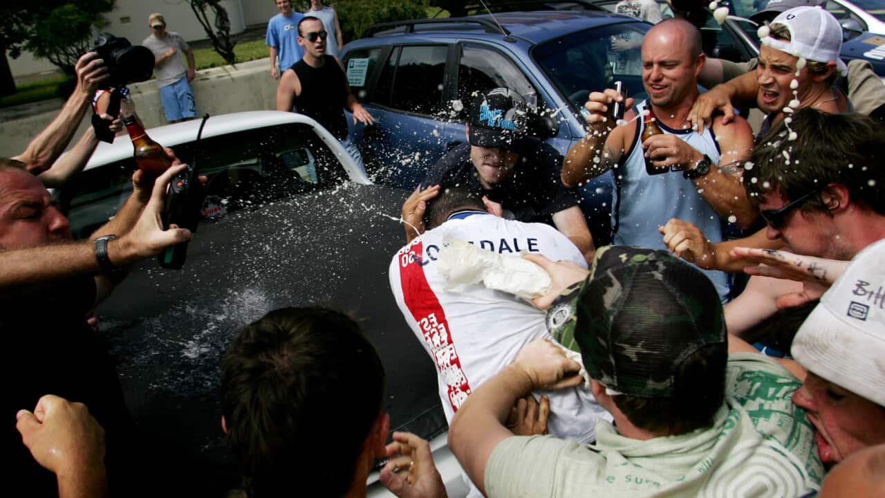 A man is atacked by a crowd at Cronulla beach in Sydney.