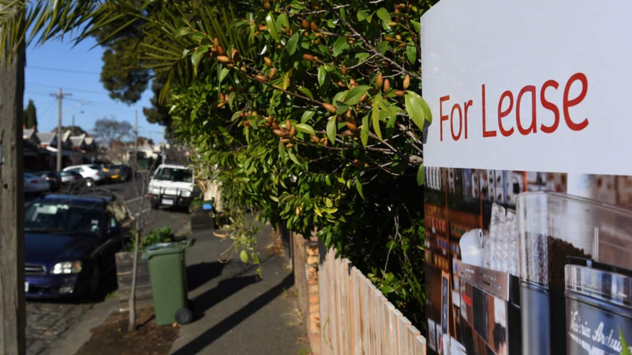 Signage for a real estate property is seen in Carlton North, Melbourne, Wednesday, July 18, 2018. (AAP Image/James Ross) NO ARCHIVING