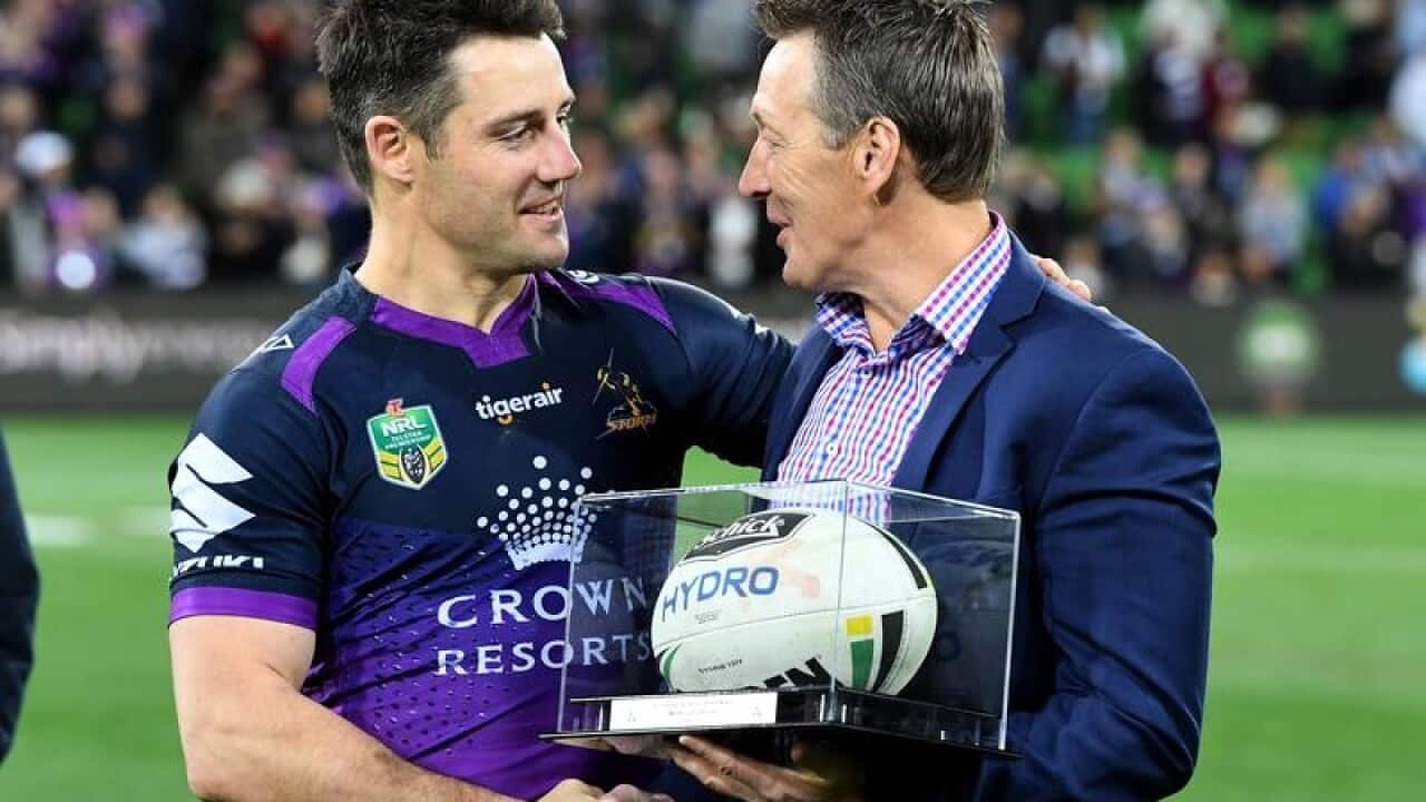 Cooper Cronk presented with match ball by coach Craig Bellamy