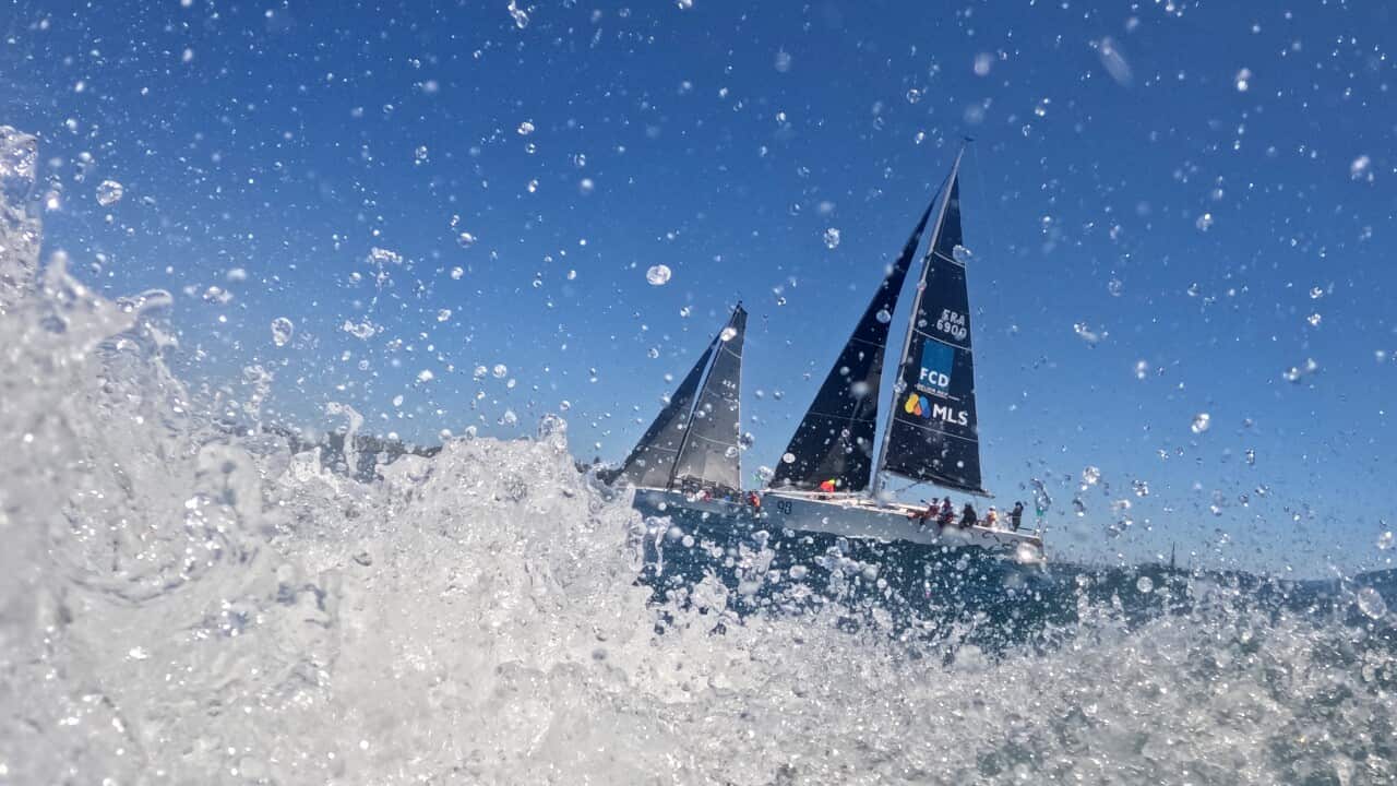 A yacht on the sea with water splashing