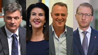 A composite image of three white men wearing suits and a woman in a blue dress