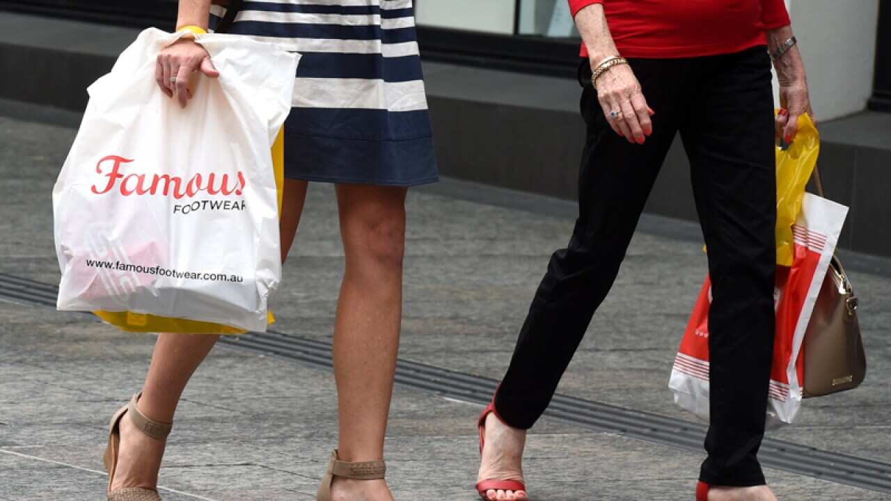 Shoppers walk through Queen Street mall in Brisbane