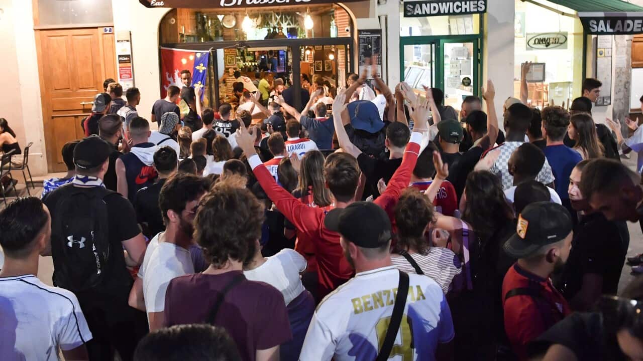 Football supporters with no social distancing at a bar in Lyon