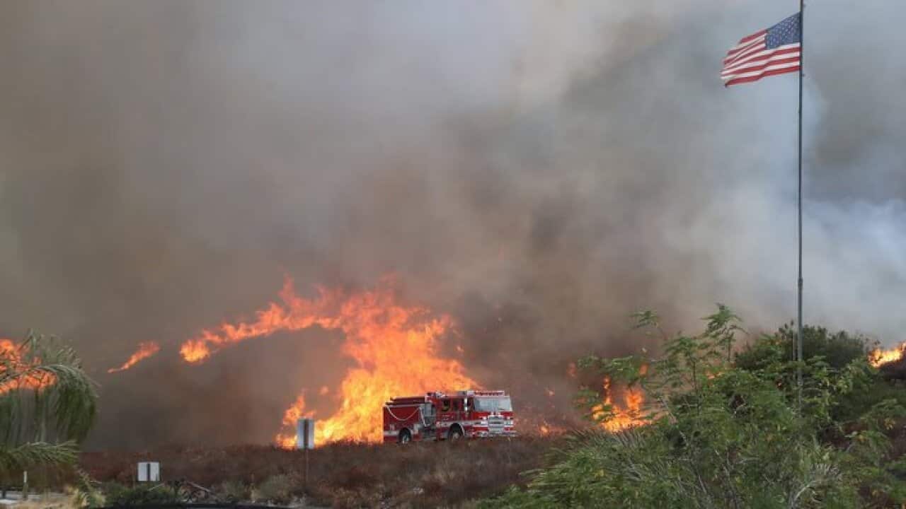 A handout photo made available by the Los Angeles Fire Department (LAFD) on their Flickr site on 02 September 2017 shows units of the LAFD on scene responding to fire along La Tuna Canyon Road near Burbank, California, USA, 01 September 2017.