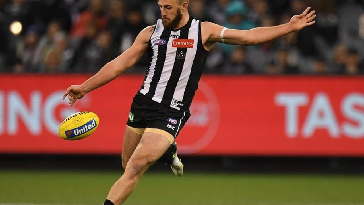 Lynden Dunn of the Magpies is seen in action