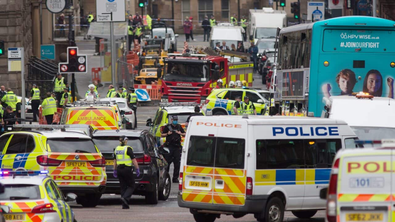 Police and emergency responders attend the scene of a stabbing incident in downtown Glasgow, Scotland.