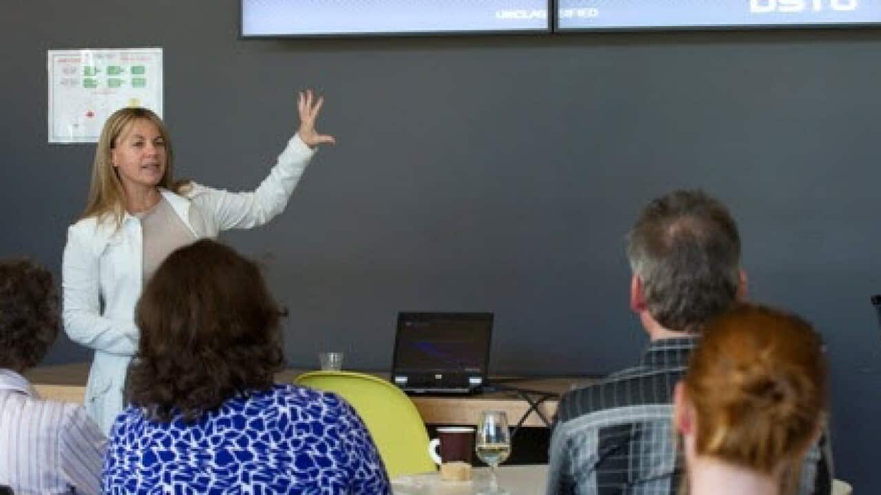 Olivia at a conference