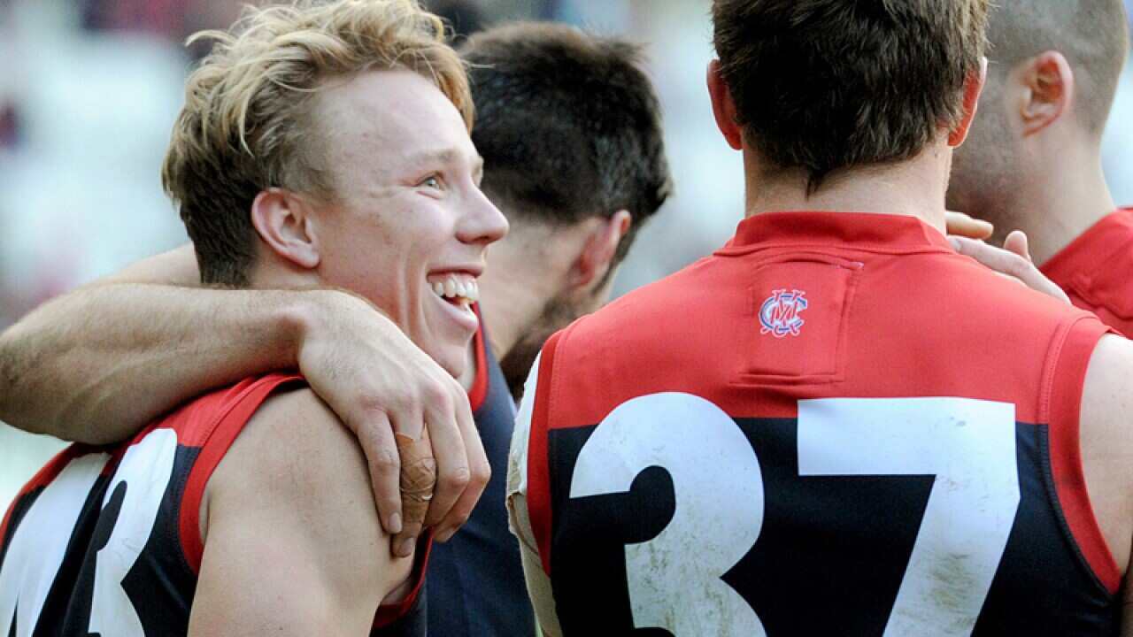 James Harmes of the Demons celebrates