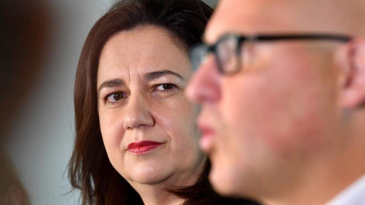 Annastacia Palaszczuk looks on as Curtis Pitt speaks