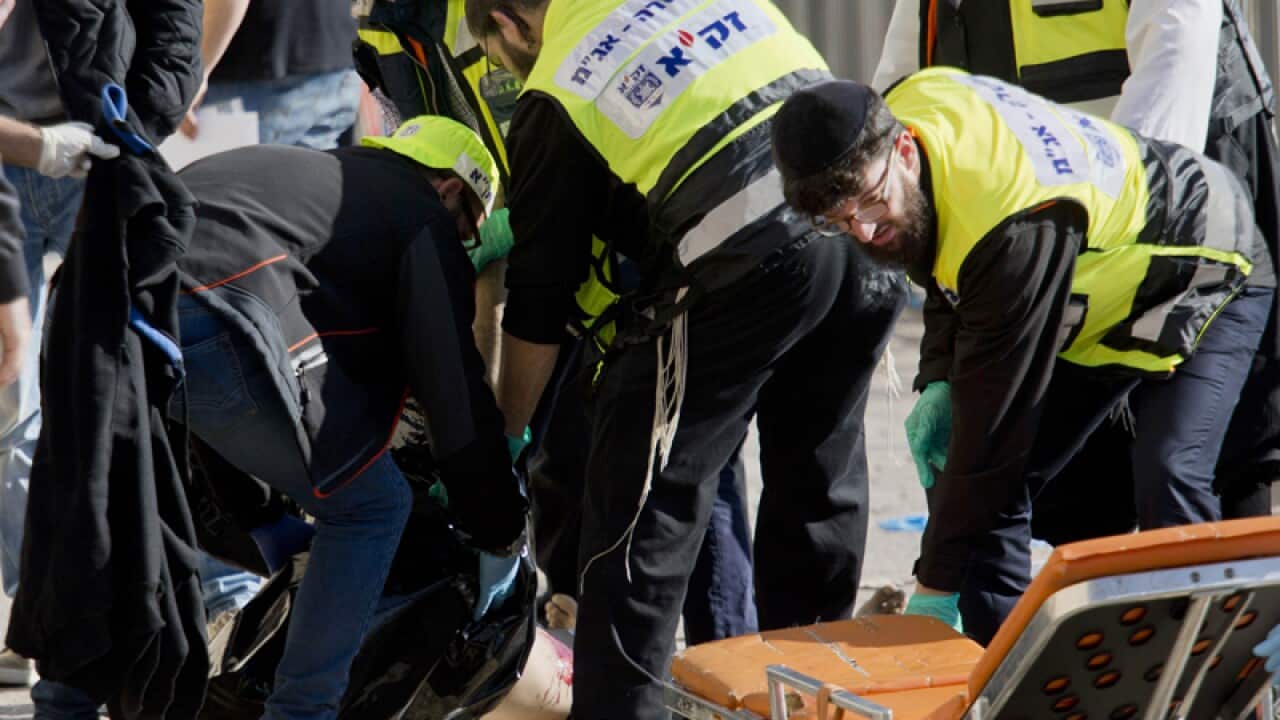 Israeli emergency services attend the scene.