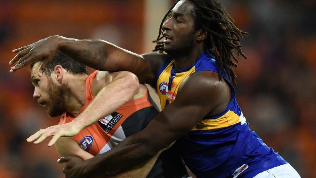 Shane Mumford GWS competes for ball with Nic Naitanui of the Eagles.