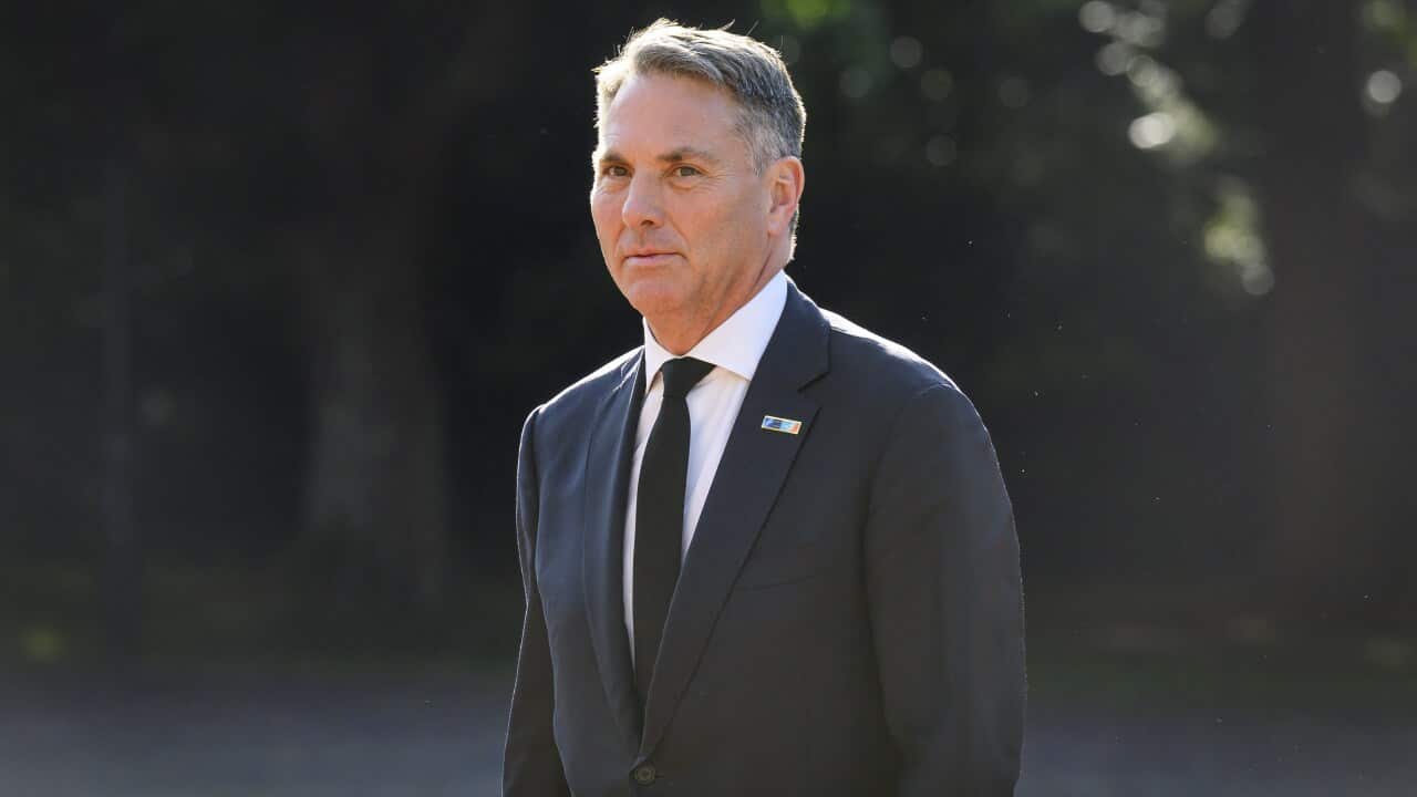 Richard Marles wearing a black suit and white shirt