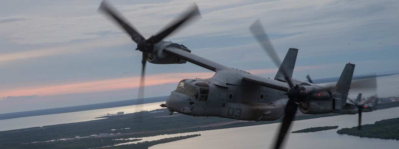 A military airplane flies over Darwin.