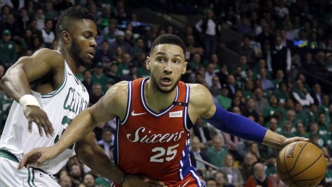Ben Simmons drives against Semi Ojeleye.