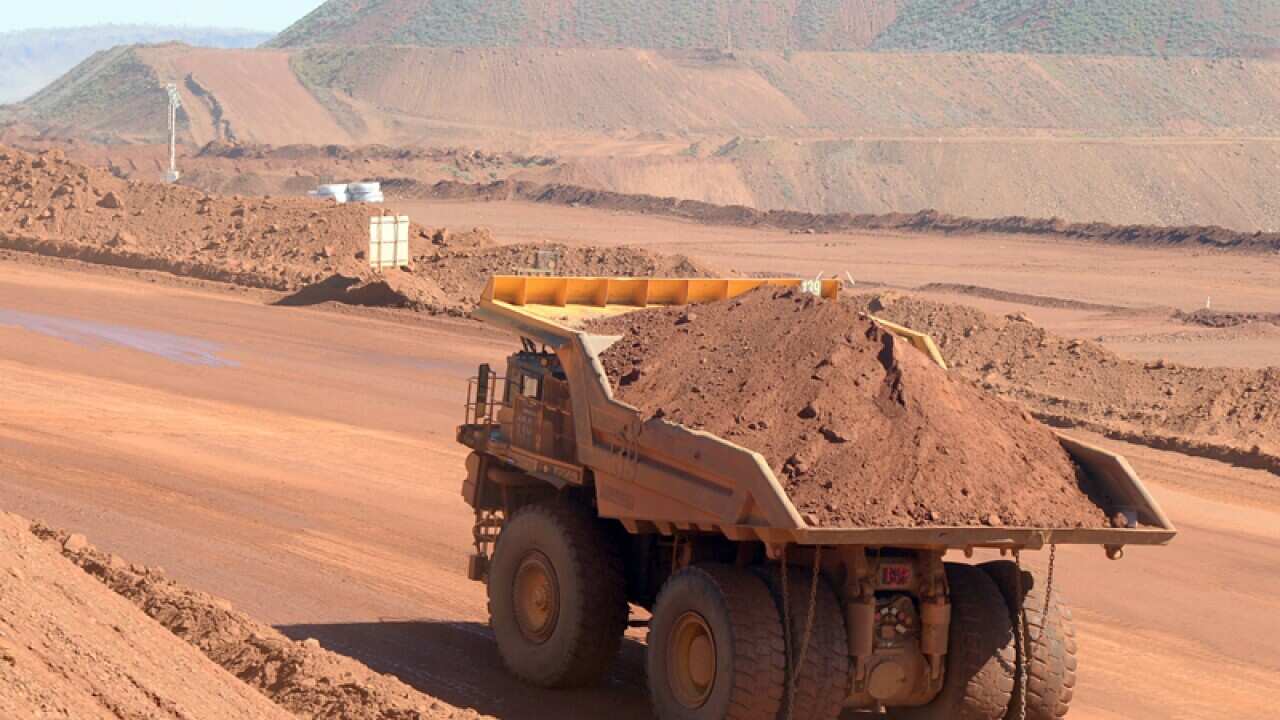 Haulage trucks at the Rio Tinto West Angelas iron ore mine