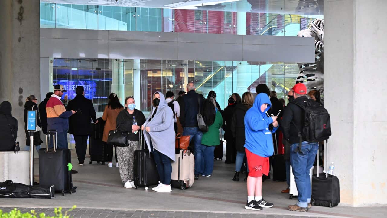 Travellers outside Canberra Airport