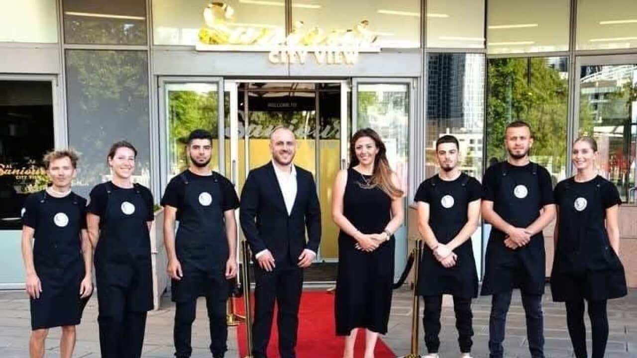 Nazem Ahmad with staff.jpg