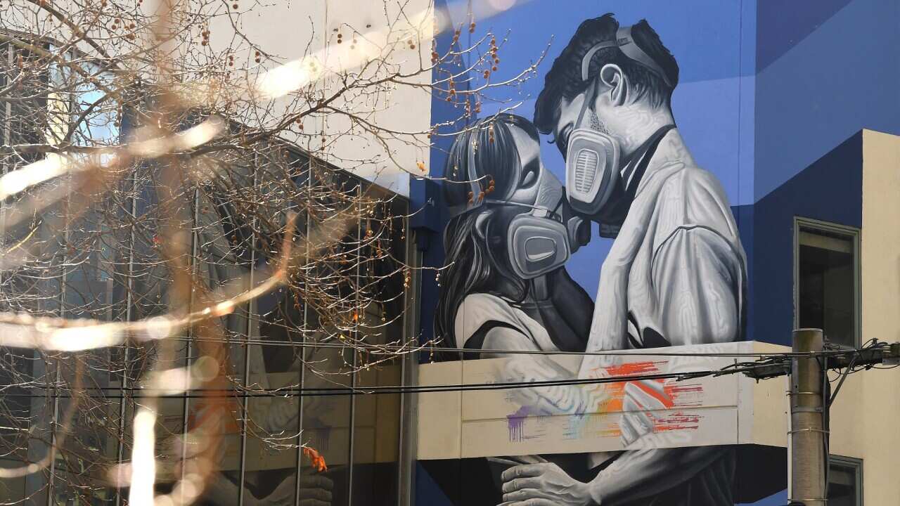 General view of coronavirus inspired street art in Melbourne, Wednesday, August 26, 2020. (AAP Image/James Ross) NO ARCHIVING