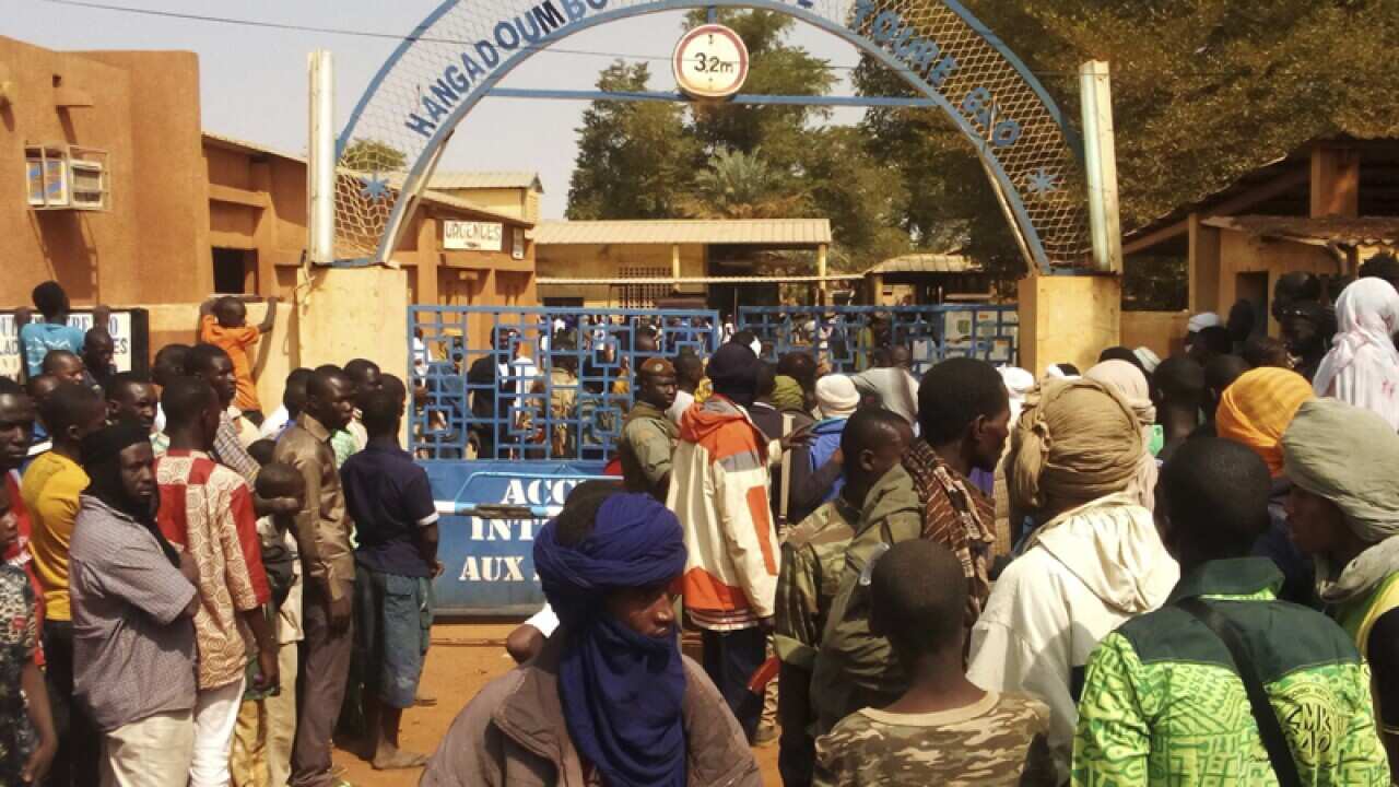 People gather outside a hospital were injured were taken