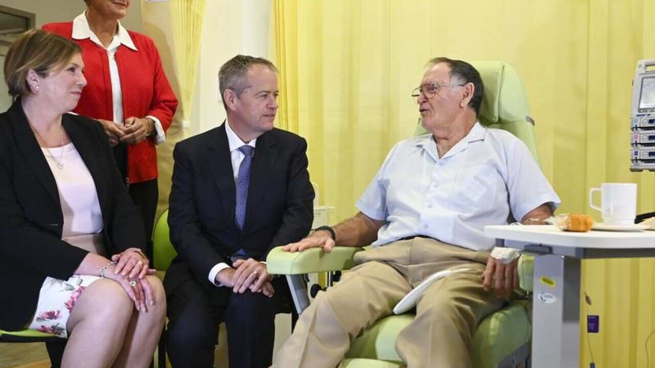 Bill Shorten talking to a cancer patient.