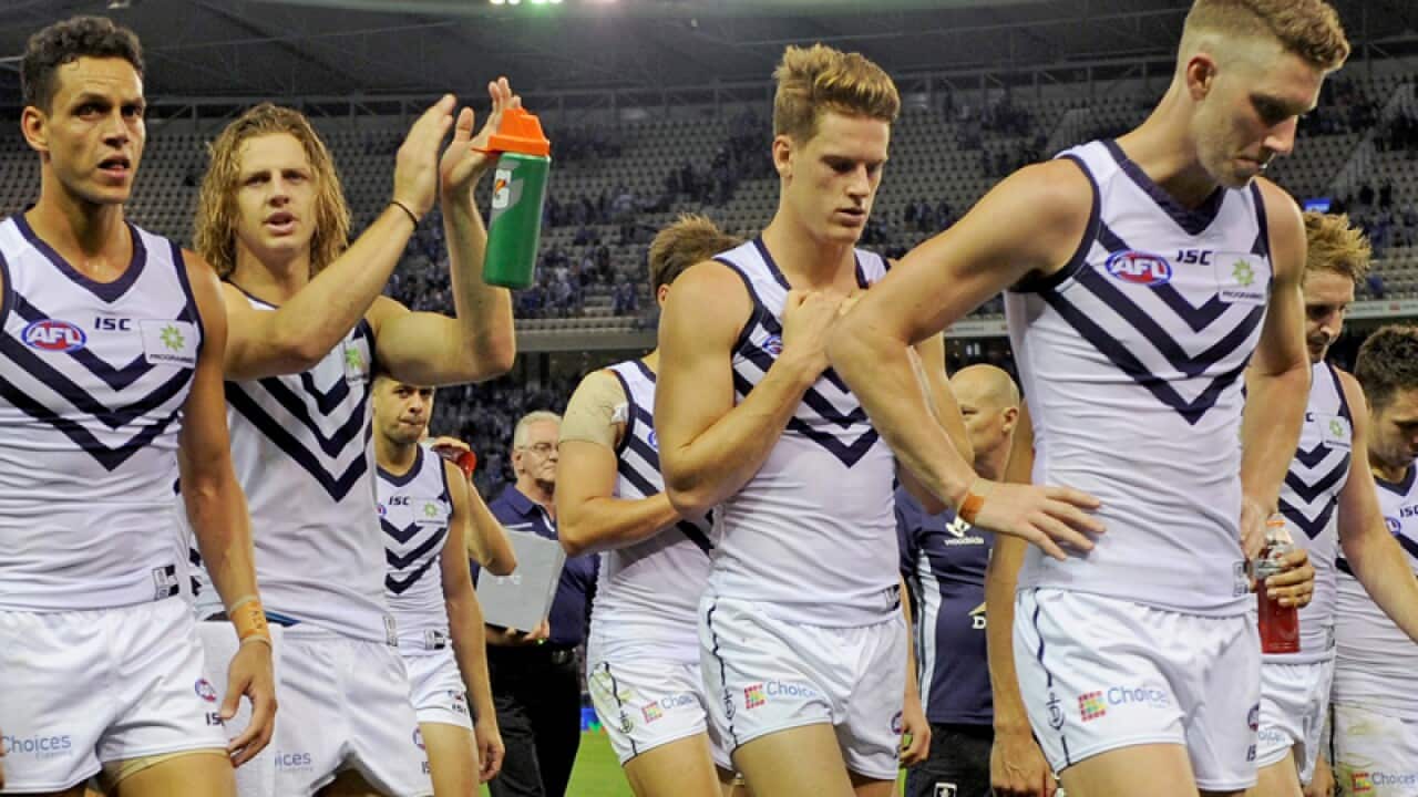 Fremantle players leave the field