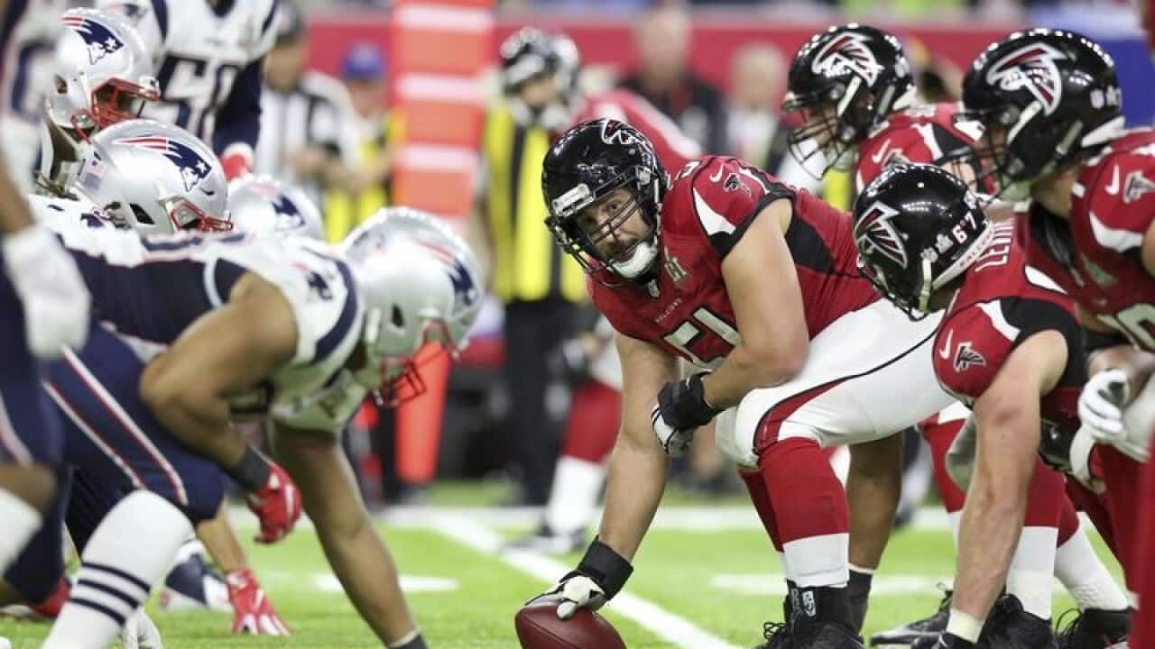 Atlanta Falcons Alex Mack #51 prepares to snap the ball
