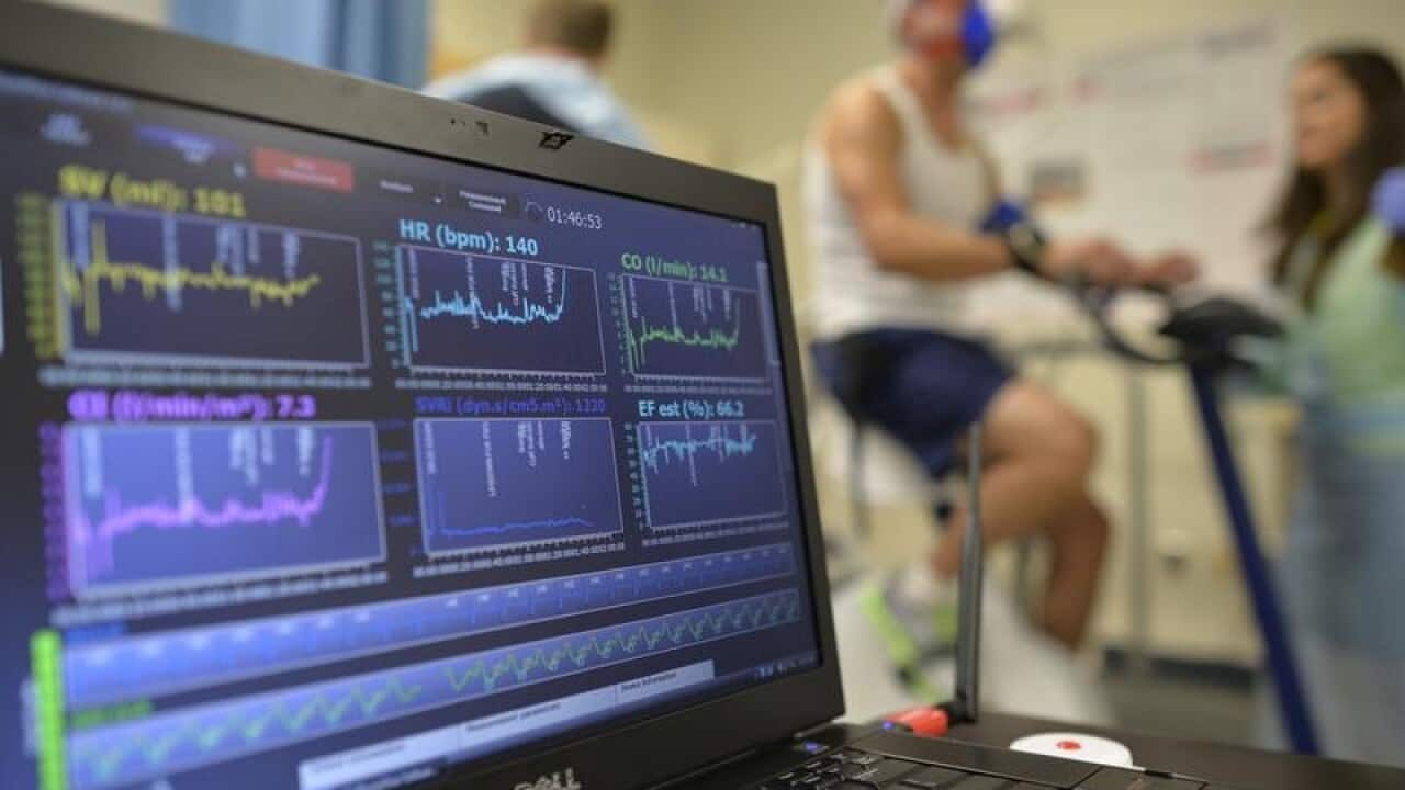 A laptop computer monitors a patient's heart function