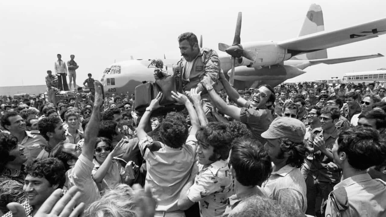 Rescue Pilot Lifted on Shoulders