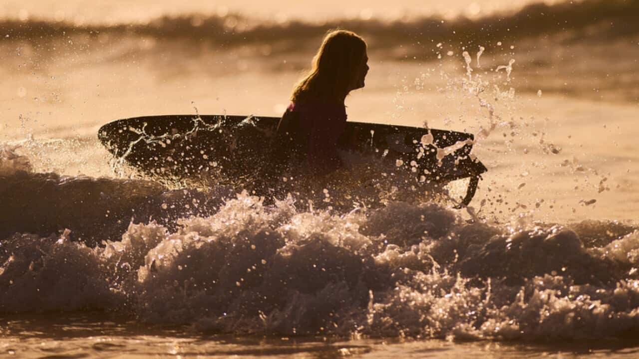 Female surfer at Freshwater Beach, in Sydney