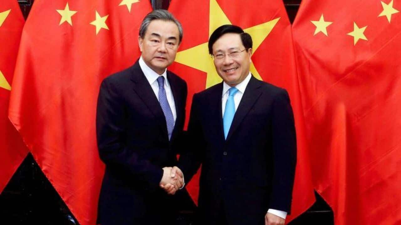 China's State Councilor and Foreign Minister Wang Yi and Vietnam's Foreign Minister Pham Binh Minh