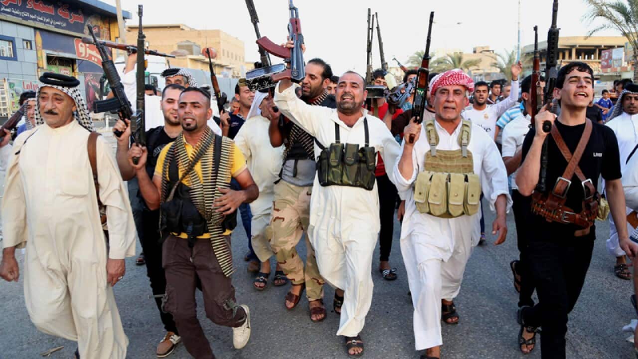 Iraqi Shiite tribal fighters chant slogans against the al-Qaida forces