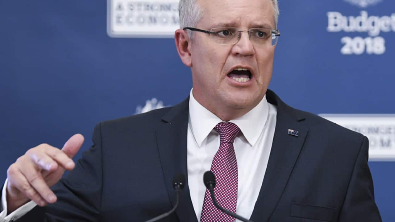 Budget has tax cuts, surplus a year early