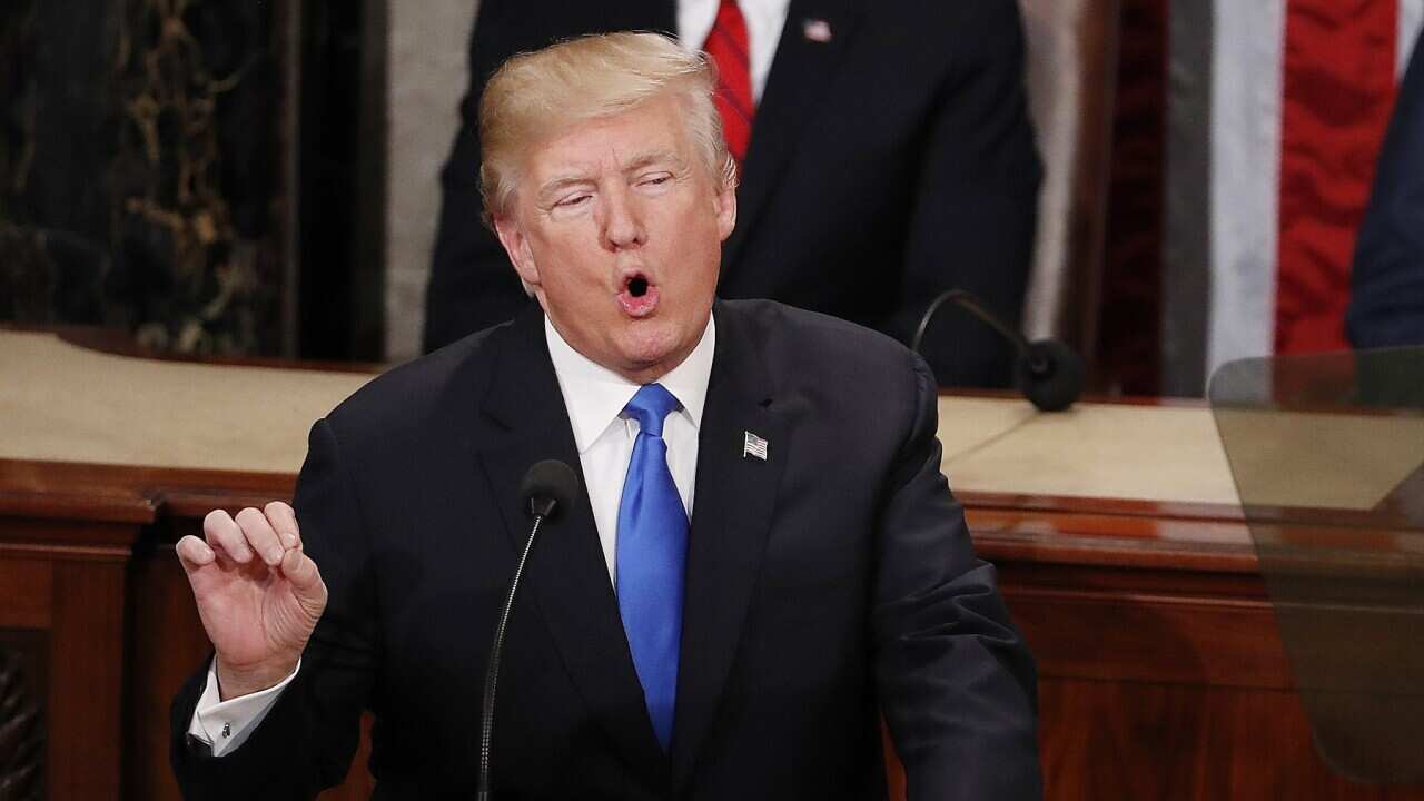 President Donald J. Trump delivers his first State of the Union from the floor of the House of Representatives in Washington, DC, USA, 30 January 2018. EPA/SHAWN THEW