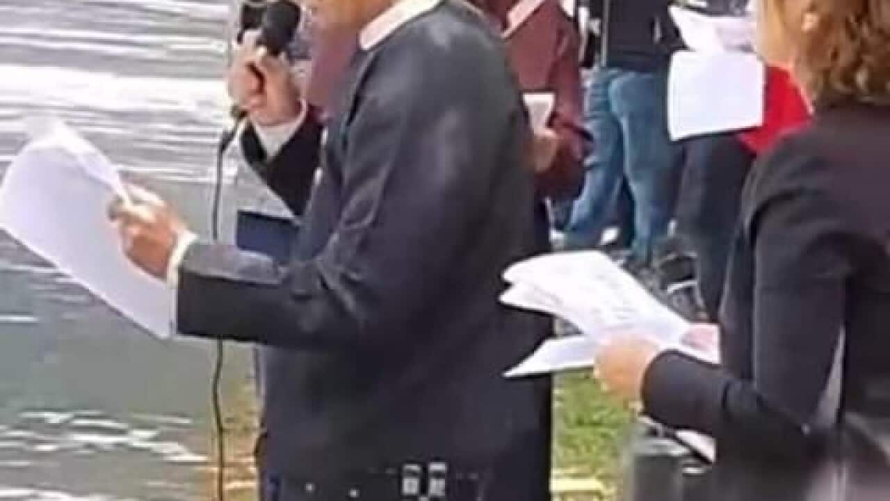 Patrick Cho speaking at Canberra demo.jpg