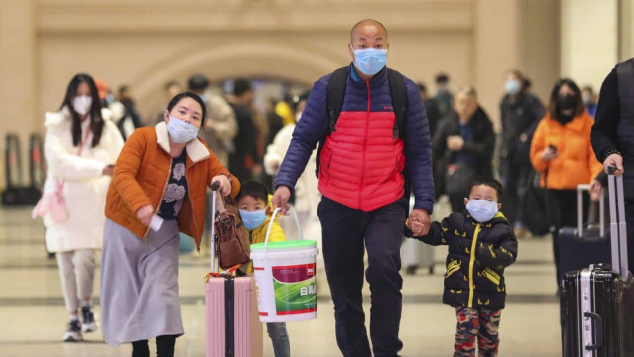 Travelers at Hankou Railway Station in Wuhan in southern China's Hubei province.