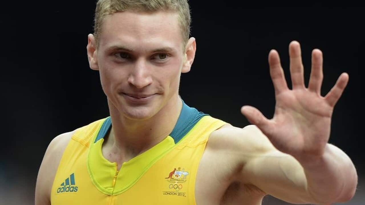 Australian athlete Steven Solomon waves.